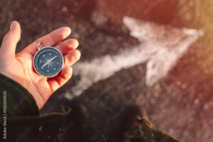 man holding compass - estate planning
